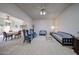 Bright and open living room with neutral tones and a view of the dining room at 13861 N 111Th Ave, Sun City, AZ 85351