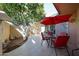 Inviting patio with outdoor seating under an orange tree offering a serene outdoor space at 13861 N 111Th Ave, Sun City, AZ 85351