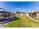 A large backyard with mature landscaping, a gazebo, a play structure, and a sparkling pool at 16302 N 36Th Ave, Phoenix, AZ 85053