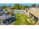 Lush backyard with mature trees, a sparkling pool, play structure, and a covered gazebo at 16302 N 36Th Ave, Phoenix, AZ 85053