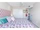 Bedroom with a ceiling fan features closet and shelving for storage and organization at 16302 N 36Th Ave, Phoenix, AZ 85053