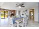 Dining area featuring a decorative table set, brick fireplace, and access to the backyard at 16302 N 36Th Ave, Phoenix, AZ 85053