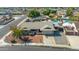 Inviting single-story home with mature landscaping, a spacious driveway, and an American flag at 16302 N 36Th Ave, Phoenix, AZ 85053