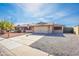 Attractive single-Gathering home features a two-car garage and low-maintenance desert landscaping at 16302 N 36Th Ave, Phoenix, AZ 85053