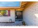 Charming front door with decorative floral decor and brick accents for a warm welcome at 16302 N 36Th Ave, Phoenix, AZ 85053