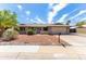 Attractive single-Gathering home with a two-car garage, desert landscaping, and a walkway to the front door at 16302 N 36Th Ave, Phoenix, AZ 85053