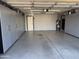 Well-organized garage with ample storage cabinets and a clean, epoxy-coated floor, maximizing space and functionality at 16302 N 36Th Ave, Phoenix, AZ 85053