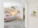 Carpeted main bedroom featuring a ceiling fan and neutral decor with ensuite bathroom at 16302 N 36Th Ave, Phoenix, AZ 85053