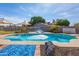 Sparkling in-ground pool with well-maintained patio and lush landscaping, perfect for summer fun at 16302 N 36Th Ave, Phoenix, AZ 85053