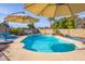 Inviting in-ground pool with surrounding patio and lounge chairs, offering a relaxing outdoor experience at 16302 N 36Th Ave, Phoenix, AZ 85053