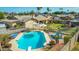 Inviting backyard pool area featuring a diving board, lush greenery, and comfortable lounge seating at 16302 N 36Th Ave, Phoenix, AZ 85053