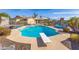 Refreshing pool with diving board and mature landscaping, creates a resort-like atmosphere at 16302 N 36Th Ave, Phoenix, AZ 85053