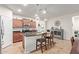 Modern kitchen featuring stainless steel appliances, granite countertops, a breakfast bar, and pendant lighting at 17532 W Bajada Rd, Surprise, AZ 85387