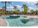 Community pool with a fountain and ample seating at 19063 N 265Th Ave, Buckeye, AZ 85396