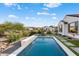 Modern backyard pool with a waterfall feature at 19063 N 265Th Ave, Buckeye, AZ 85396