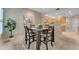 Spacious dining area with a wooden table and chairs, open to the kitchen at 19700 N 76Th St # 1112, Scottsdale, AZ 85255