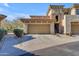 Attached garage with stairs leading to the home's entrance at 19700 N 76Th St # 1112, Scottsdale, AZ 85255