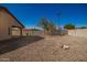 Backyard with gravel landscaping and a covered patio at 201 2Nd E Ave, Buckeye, AZ 85326