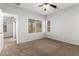 Bright bedroom with ceiling fan and carpet flooring at 201 2Nd E Ave, Buckeye, AZ 85326