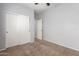 Well-lit bedroom with double door closet and carpet at 201 2Nd E Ave, Buckeye, AZ 85326