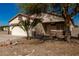 Single-story house with a two-car garage and a front yard at 201 2Nd E Ave, Buckeye, AZ 85326