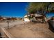 Single-story house with a two-car garage and a front yard at 201 2Nd E Ave, Buckeye, AZ 85326