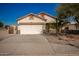 Single-story house with a two-car garage and desert landscaping at 201 2Nd E Ave, Buckeye, AZ 85326