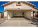 Empty double car garage with an open door at 201 2Nd E Ave, Buckeye, AZ 85326