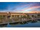 Scenic sunset view of waterfront homes and canal at 20208 N Oxbow Ln, Maricopa, AZ 85138