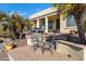 Patio furniture overlooks a beautifully landscaped backyard at 20208 N Oxbow Ln, Maricopa, AZ 85138