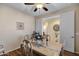 Bright dining area with hardwood floors and an open view into the adjacent room at 20208 N Oxbow Ln, Maricopa, AZ 85138