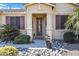 Inviting front entrance with a decorative door and well-maintained landscaping at 20208 N Oxbow Ln, Maricopa, AZ 85138