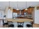 Modern kitchen with granite countertops, stainless steel appliances, and ample cabinetry at 20208 N Oxbow Ln, Maricopa, AZ 85138