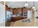 Modern kitchen with granite countertops and stainless steel appliances at 20208 N Oxbow Ln, Maricopa, AZ 85138