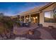 Spacious patio features a fire pit and ample seating at 20208 N Oxbow Ln, Maricopa, AZ 85138