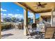 Spacious covered patio with lake views and a grill at 20208 N Oxbow Ln, Maricopa, AZ 85138