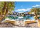 Relaxing patio with seating area overlooking a lake at 20208 N Oxbow Ln, Maricopa, AZ 85138