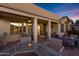 Covered patio with seating area and fire pit feature at 20208 N Oxbow Ln, Maricopa, AZ 85138