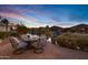 Relaxing patio with fire pit overlooking the canal at 20208 N Oxbow Ln, Maricopa, AZ 85138