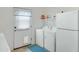 Functional laundry area with a washer, dryer, and a refrigerator at 2105 N Kachina --, Mesa, AZ 85203