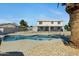 Fenced in Pool with a boulder accented garden at 2105 N Kachina --, Mesa, AZ 85203