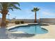 Swimming pool with decorative concrete border and palm trees at 2105 N Kachina --, Mesa, AZ 85203