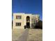 Two-story building exterior with tan stucco and arched entryway at 2108 E Dunbar Dr, Tempe, AZ 85282