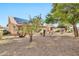 Spacious backyard with solar panels and desert landscaping at 22506 N Mirage Ln, Sun City West, AZ 85375