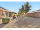 Landscaped backyard with gravel and desert plants at 22506 N Mirage Ln, Sun City West, AZ 85375