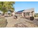 View of backyard with solar panels and grill at 22506 N Mirage Ln, Sun City West, AZ 85375