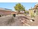 Landscaped backyard with gravel, plants, and grill at 22506 N Mirage Ln, Sun City West, AZ 85375