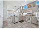 Kitchen with granite counters, white appliances, and breakfast bar at 22506 N Mirage Ln, Sun City West, AZ 85375