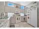 Kitchen with granite counters, white appliances, and decorative backsplash at 22506 N Mirage Ln, Sun City West, AZ 85375