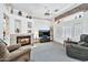 Living room with fireplace, TV, and comfortable seating at 22506 N Mirage Ln, Sun City West, AZ 85375